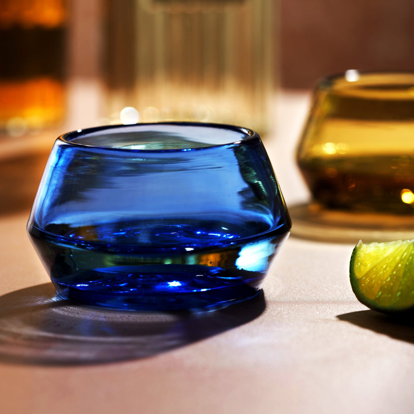 Handmade recycled glass tequila sipper close-up