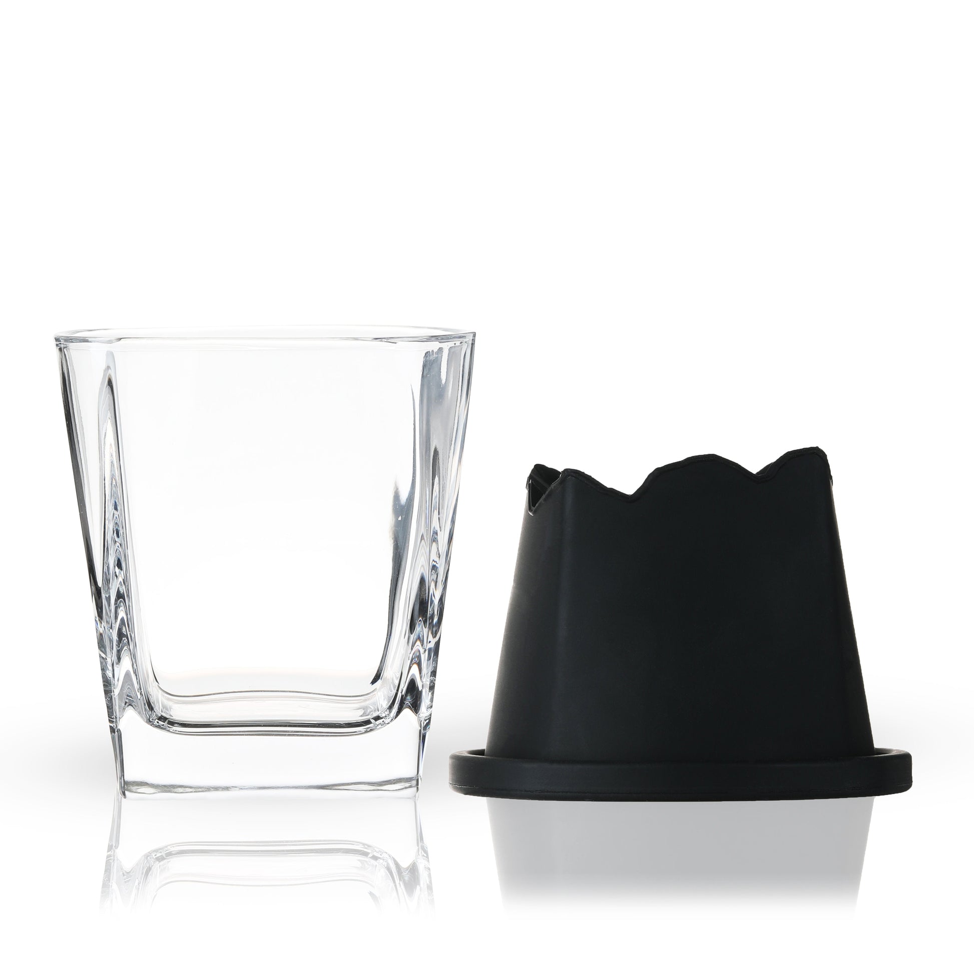 Silicone ice mold next to glass